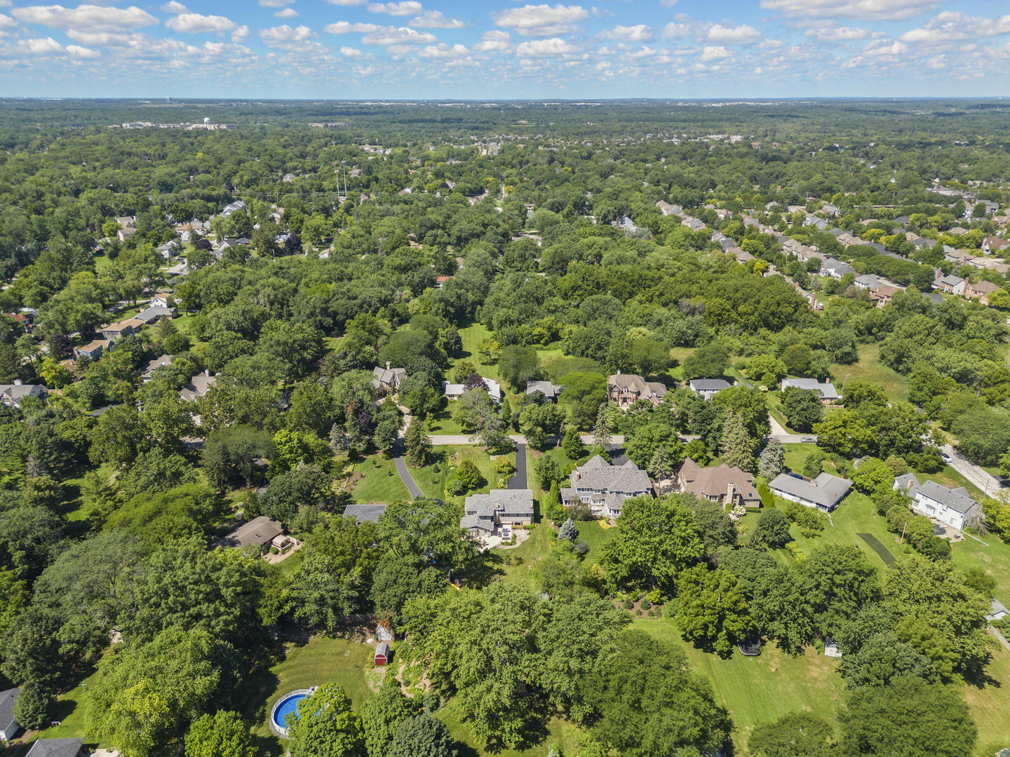 N521 Willow Road Wheaton, IL 60187 - Photo 56 of 64 an aerial view of residential houses with outdoor space and trees all around
