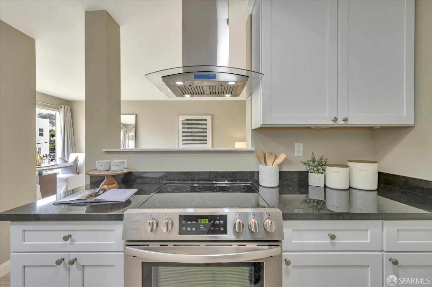 1585 10th Avenue, Unit 3 San Francisco, CA 94122 - Photo 13 of 32 a kitchen with a stove and cabinets