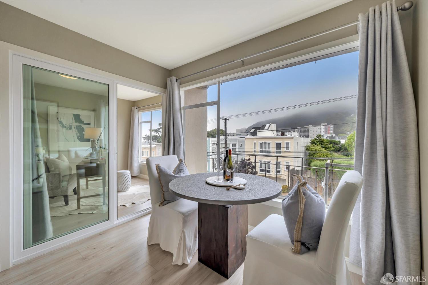 1585 10th Avenue, Unit 3 San Francisco, CA 94122 - Photo 15 of 32 a view of a dining room with furniture window and wooden floor