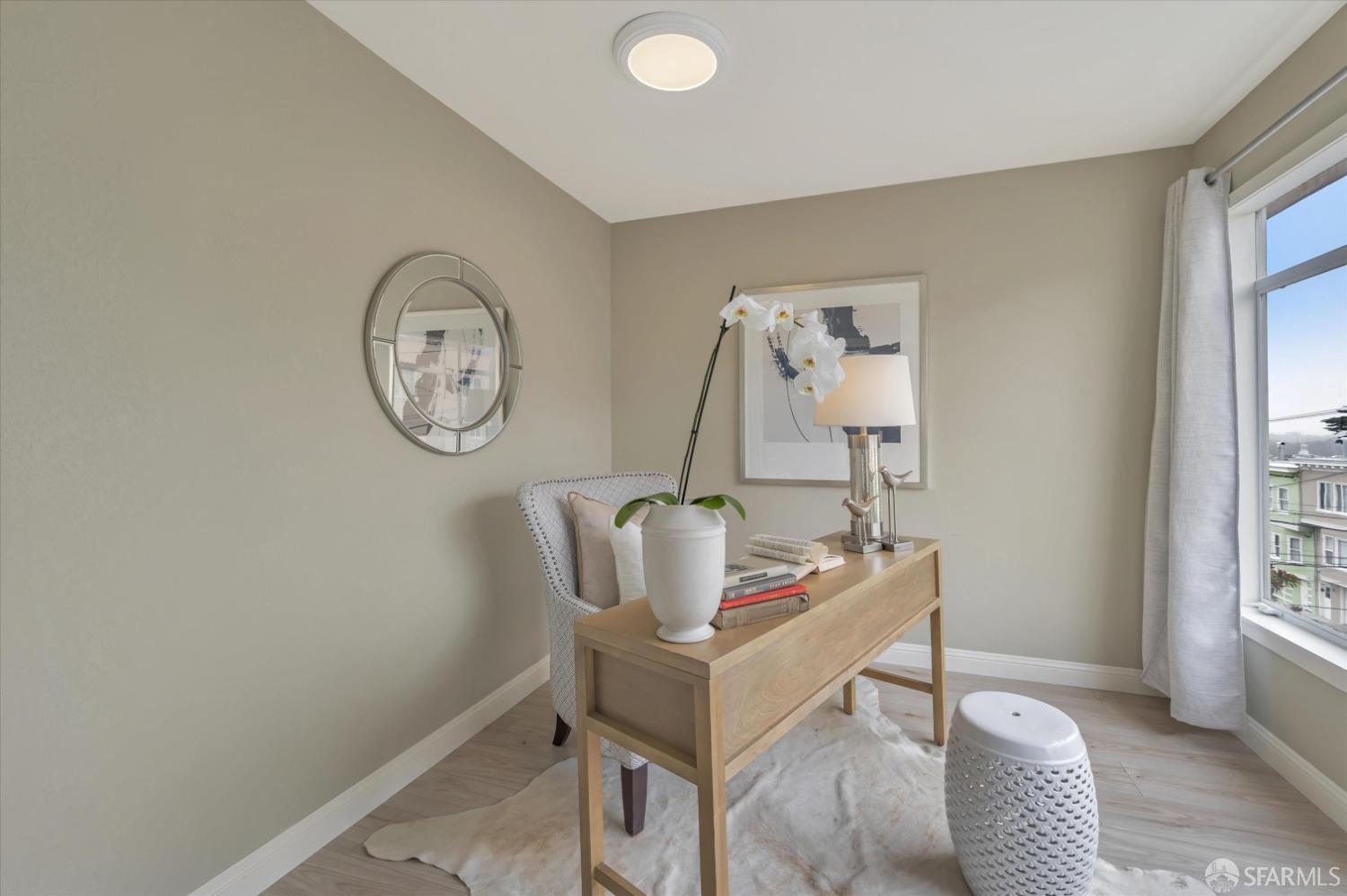 1585 10th Avenue, Unit 3 San Francisco, CA 94122 - Photo 17 of 32 a view of a workspace with furniture and a window