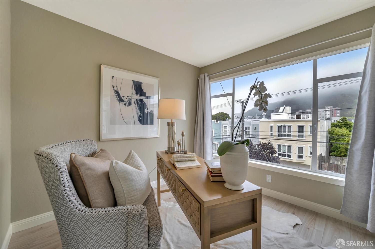 1585 10th Avenue, Unit 3 San Francisco, CA 94122 - Photo 18 of 32 a living room with furniture and window