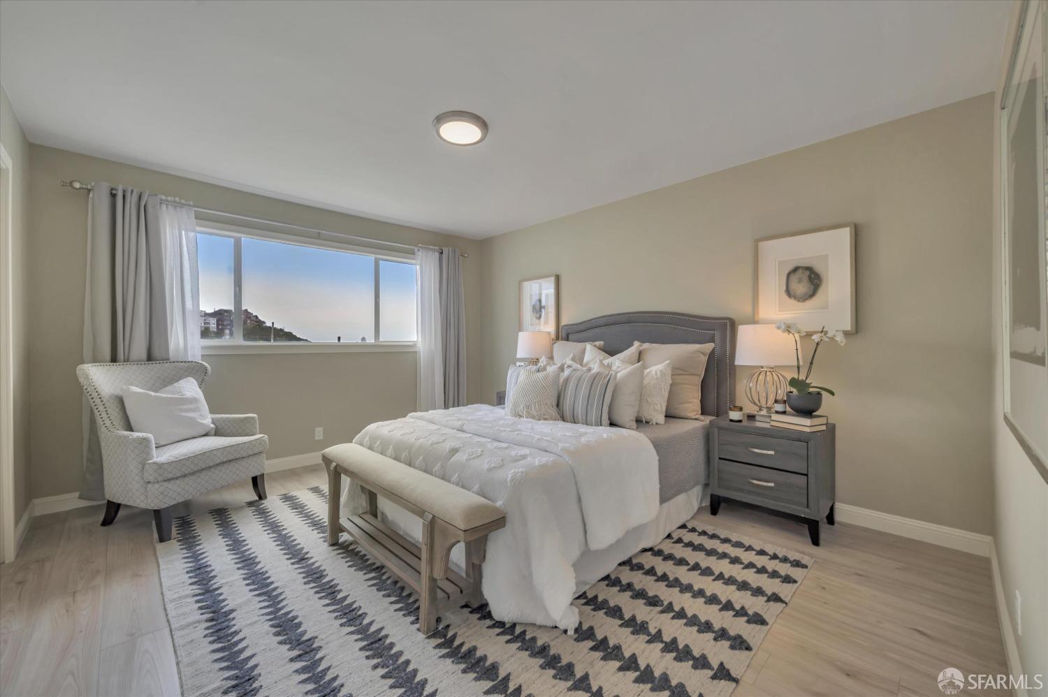 1585 10th Avenue, Unit 3 San Francisco, CA 94122 - Photo 19 of 32 a bedroom with a bed and a couch