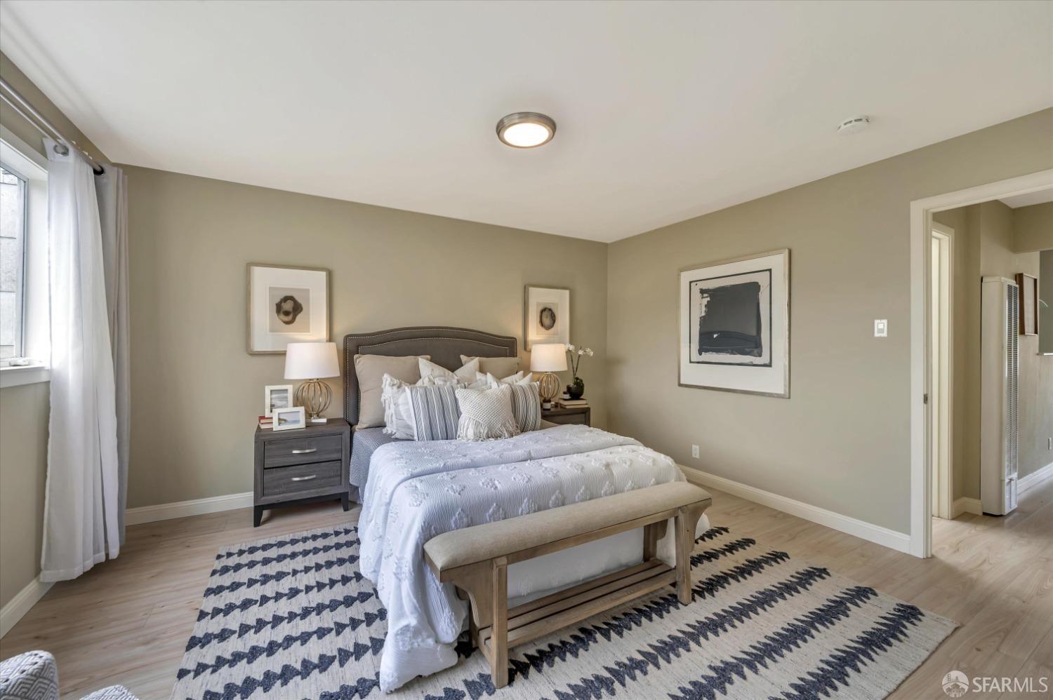 1585 10th Avenue, Unit 3 San Francisco, CA 94122 - Photo 21 of 32 a bedroom with a bed and a window