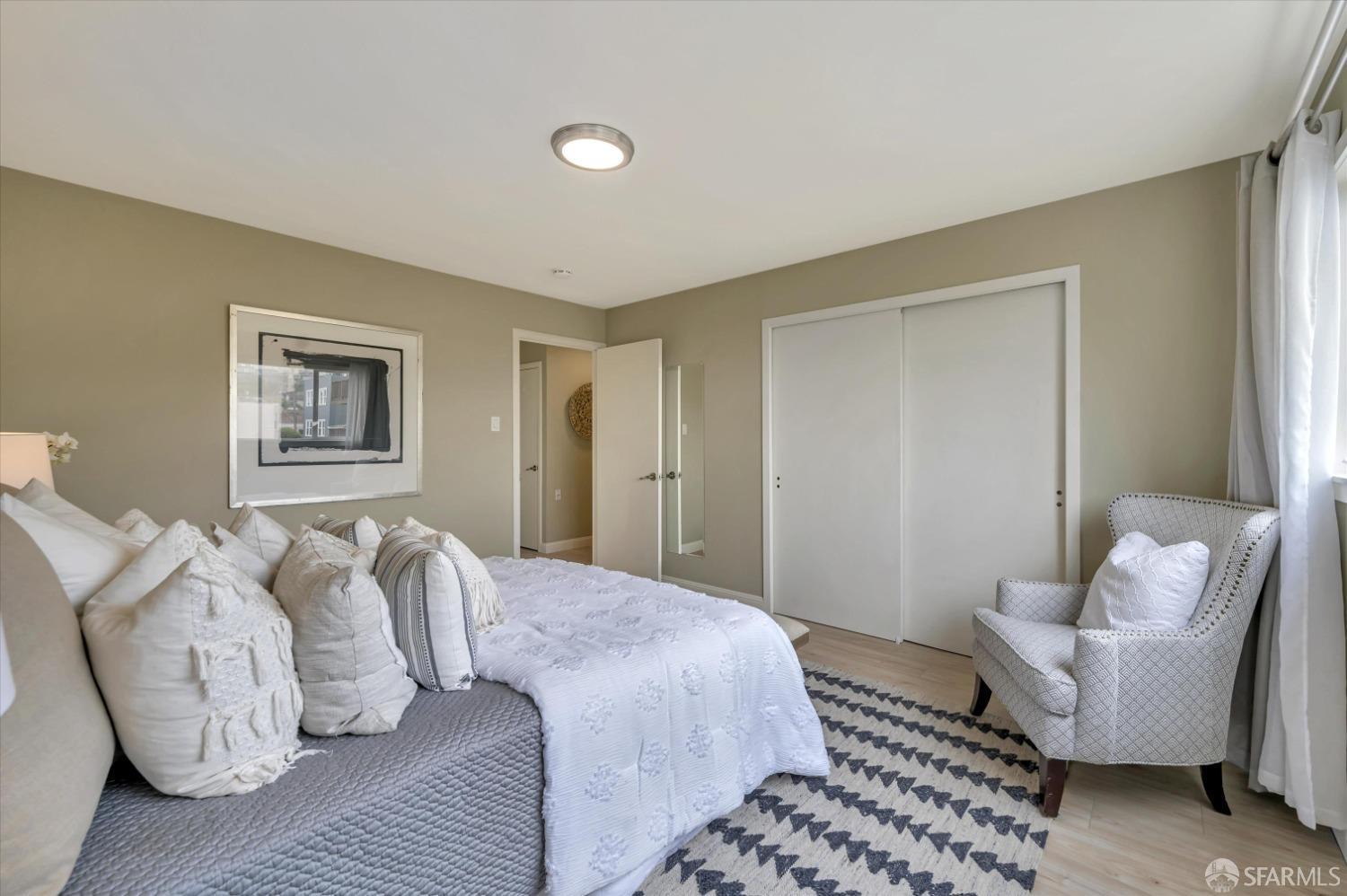 1585 10th Avenue, Unit 3 San Francisco, CA 94122 - Photo 22 of 32 a bedroom with furniture and a couch