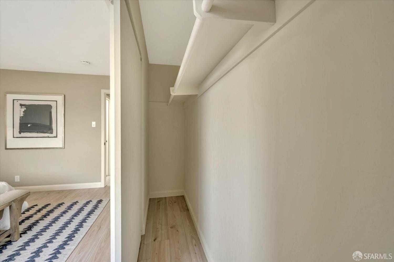 1585 10th Avenue, Unit 3 San Francisco, CA 94122 - Photo 25 of 32 a view of a room with wooden floor and staircase