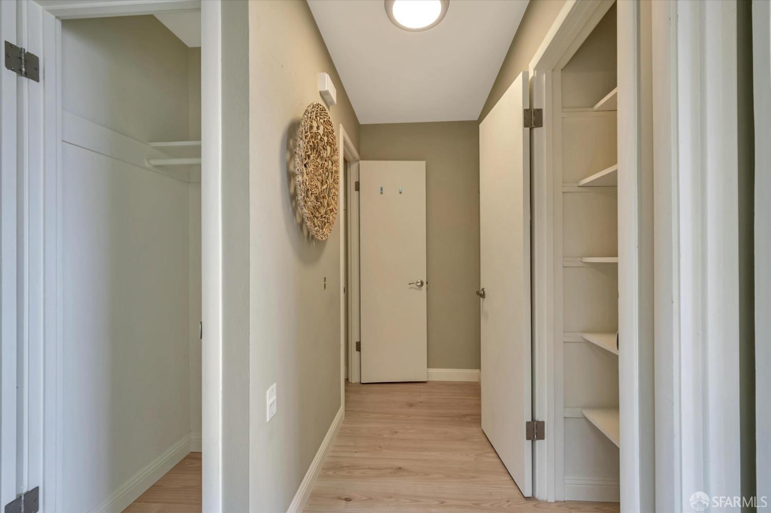 1585 10th Avenue, Unit 3 San Francisco, CA 94122 - Photo 26 of 32 a view of a hallway with wooden floor and entryway