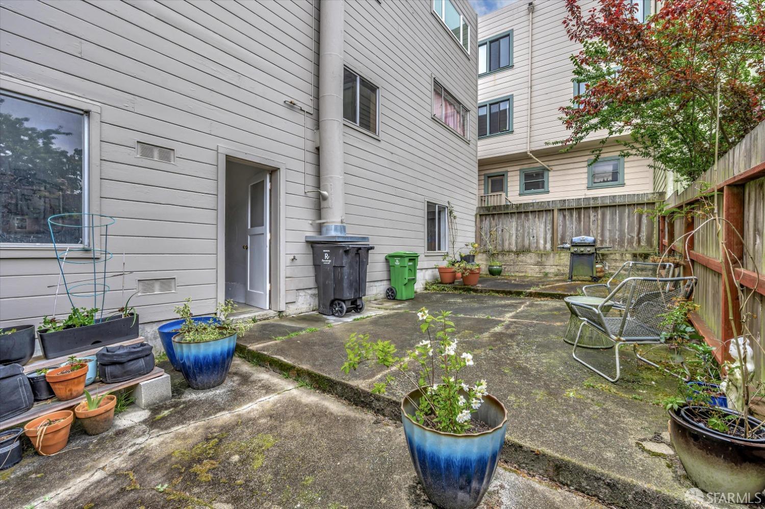 1585 10th Avenue, Unit 3 San Francisco, CA 94122 - Photo 30 of 32 a view of a patio with chairs and a potted plant