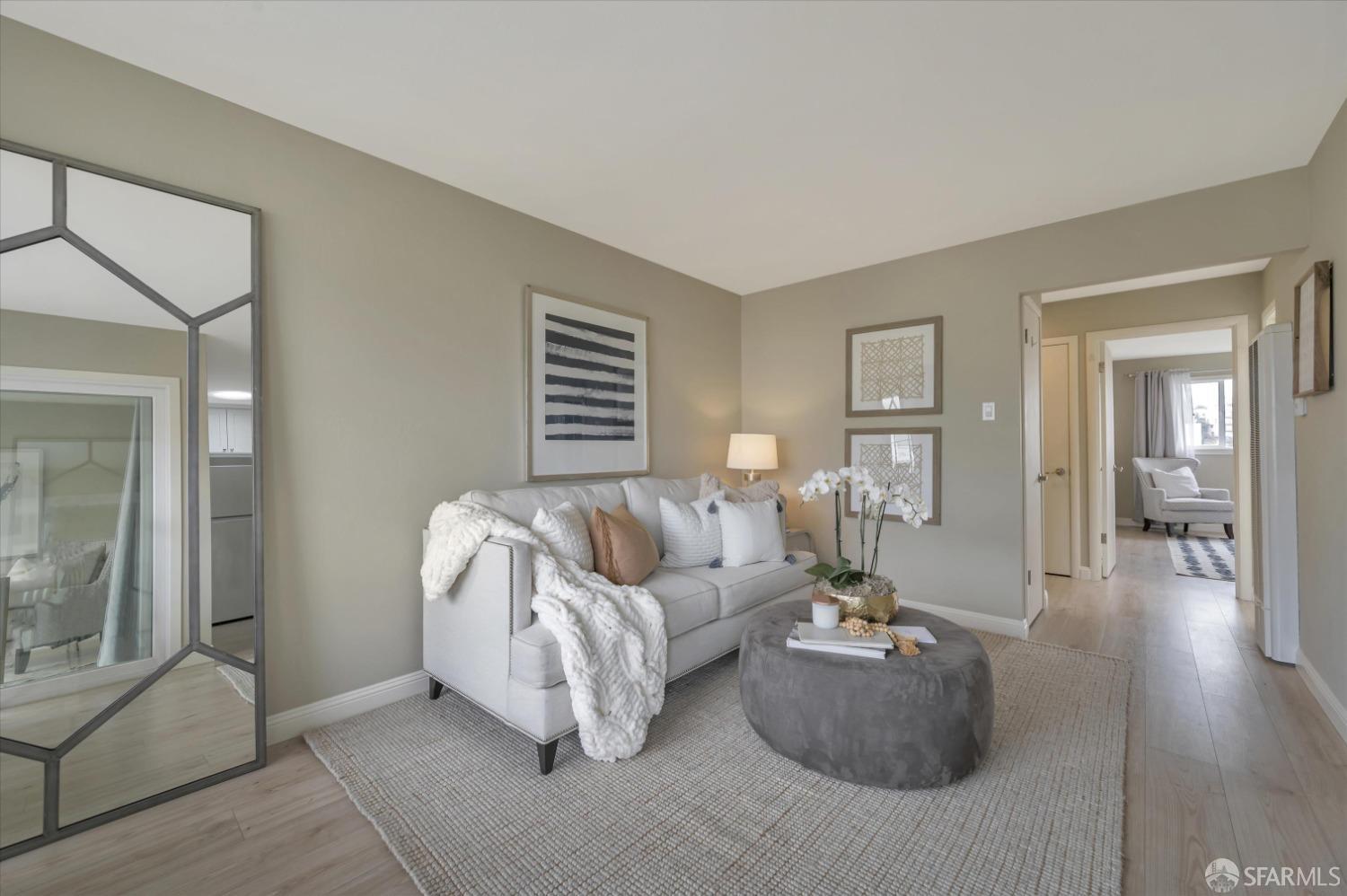 1585 10th Avenue, Unit 3 San Francisco, CA 94122 - Photo 8 of 32 a living room with furniture and a wooden floor