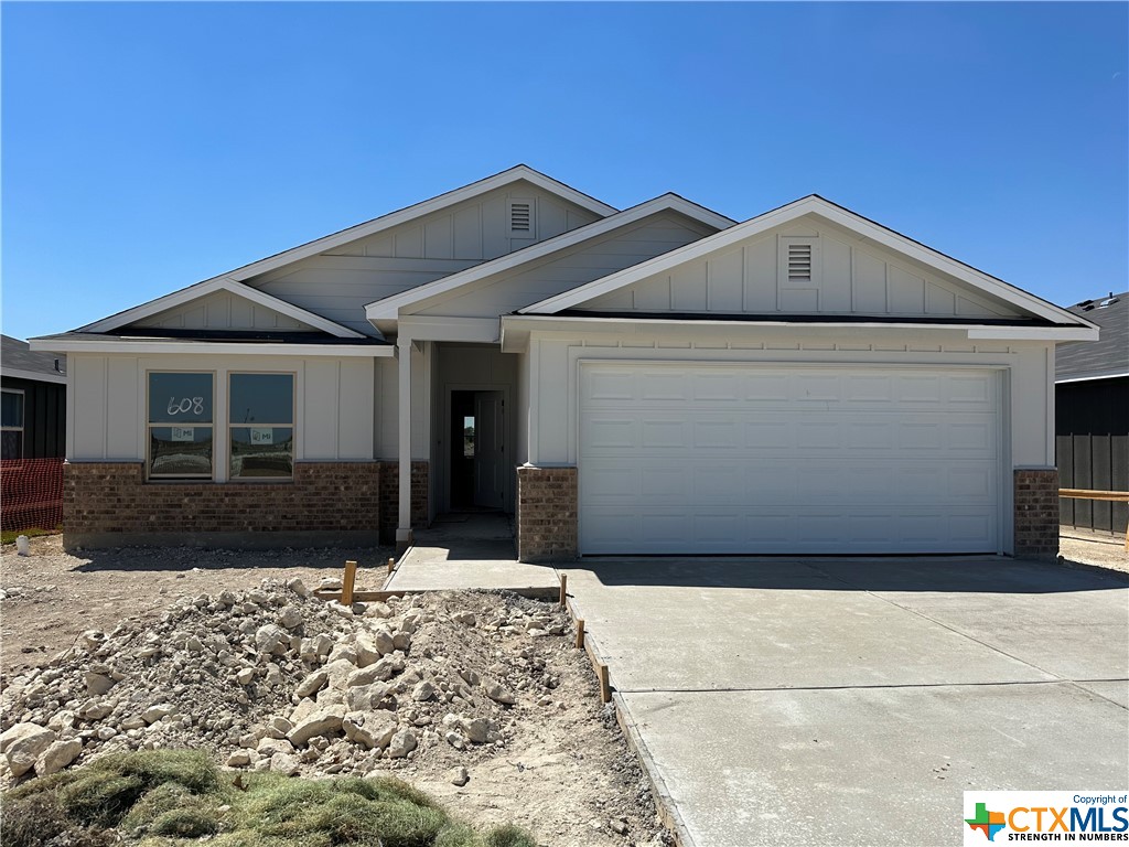 608 Double Vision Road Jarrell, TX 76537 - Photo 1 of 1 a front view of a house with a yard