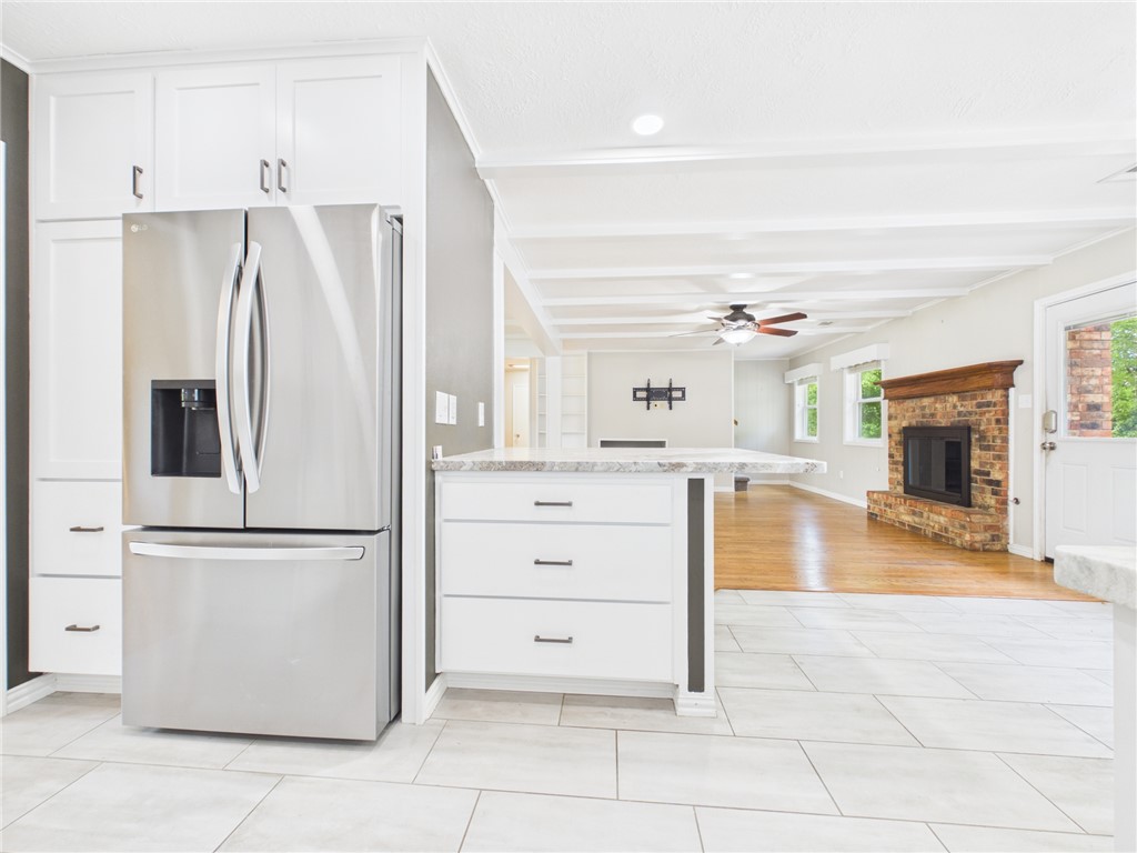 902 Briar Bend Court Bryan, TX 77802 - Photo 12 of 39 a kitchen with a refrigerator and a stove top oven