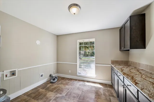 a view of a kitchen with a sink and dishwasher
