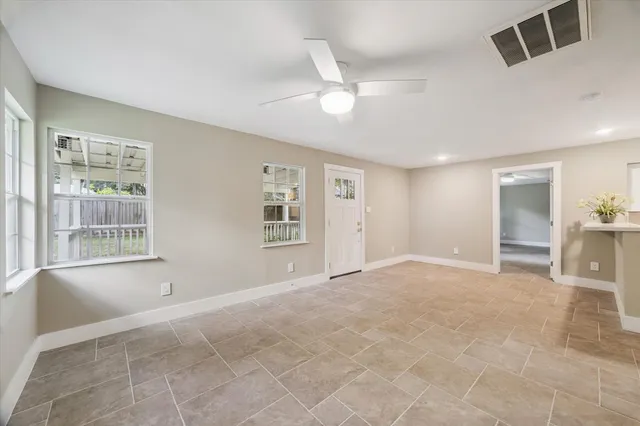 a view of an empty room with a window