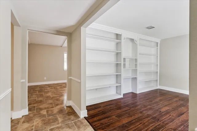a view of room with wooden floor