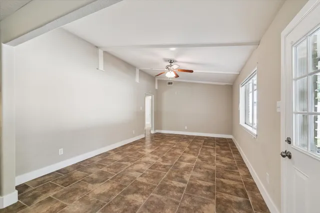 a view of an empty room with a window