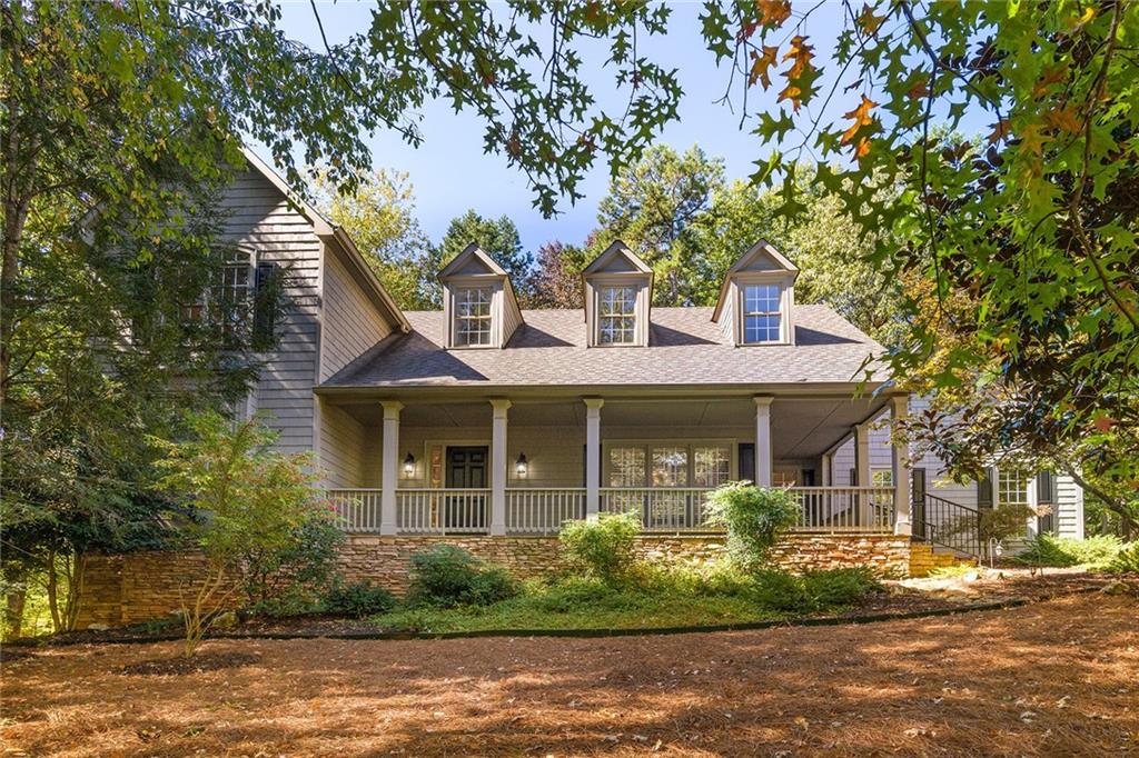 39 Meadow Brook Ridge Big Canoe, GA 30143 - Photo 1 of 1 a front view of a house with garden