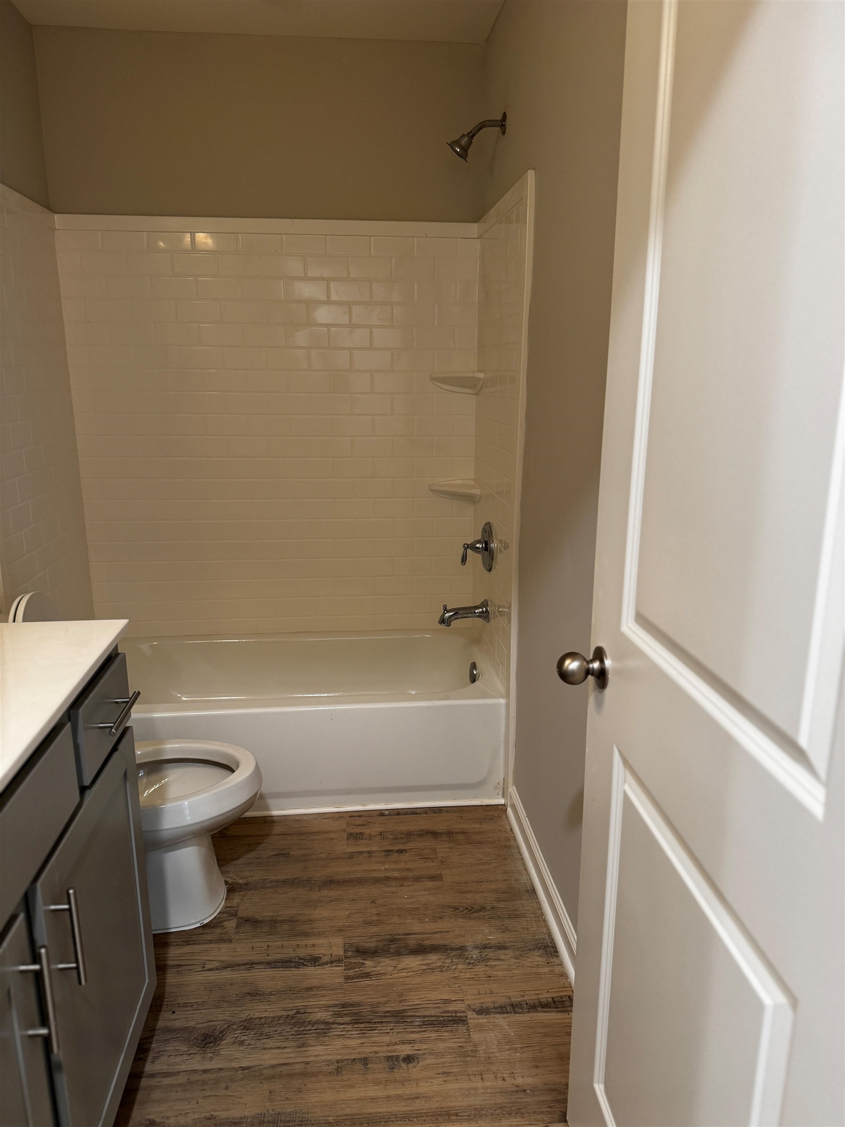 5269 Zodiac Road Memphis, TN 38118 - Photo 8 of 14 Full bath featuring vanity, shower combination, and wood finished floors