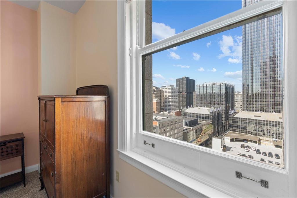 306 Fourth Avenue, Unit 1203 Pittsburgh, PA 15222 - Photo 20 of 40 a view of a living room with a floor to ceiling window and an outdoor view