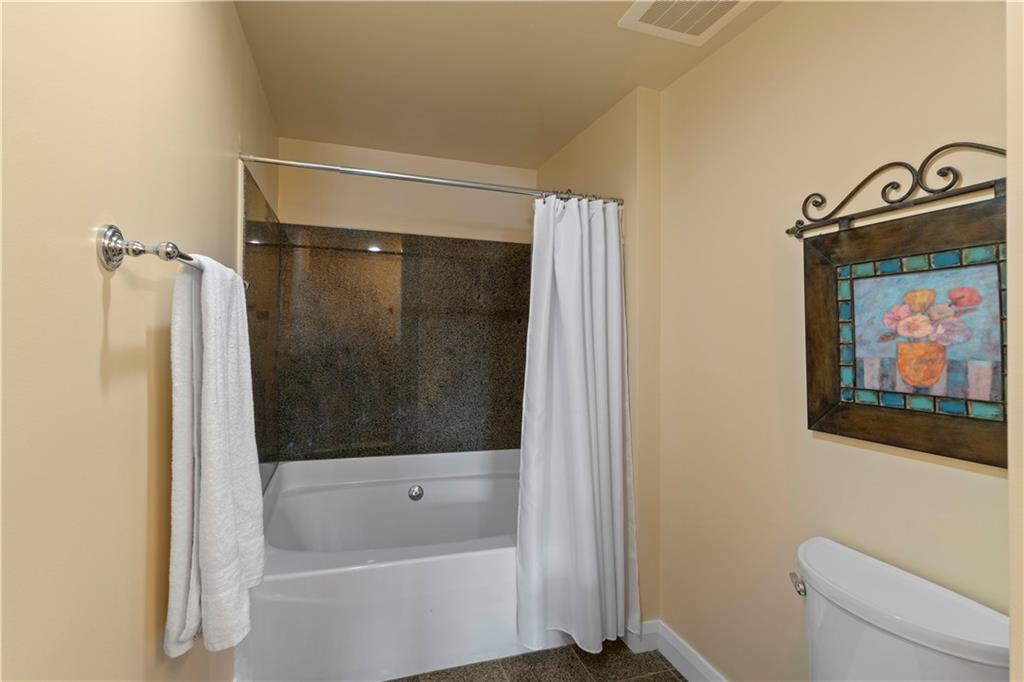 306 Fourth Avenue, Unit 1203 Pittsburgh, PA 15222 - Photo 24 of 40 a bathroom with a tub and a shower