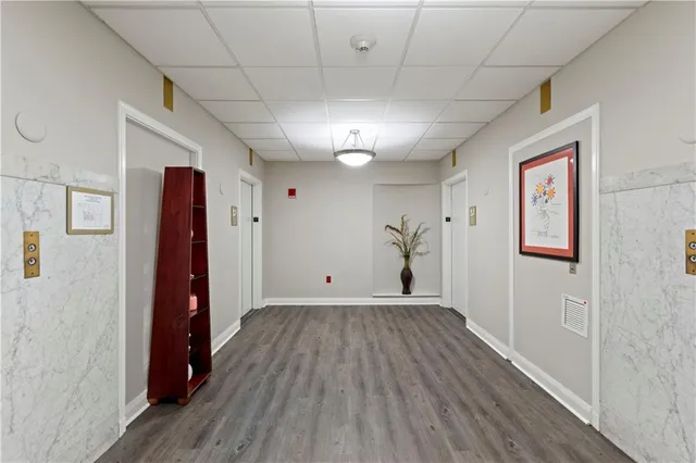 a view of a room with wooden floor and closet