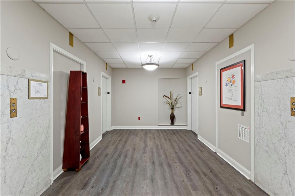 306 Fourth Avenue, Unit 1203 Pittsburgh, PA 15222 - Photo 3 of 40 a view of a room with wooden floor and closet