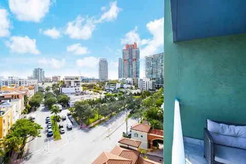 a kitchen with stainless steel appliances kitchen island granite countertop a refrigerator and a stove