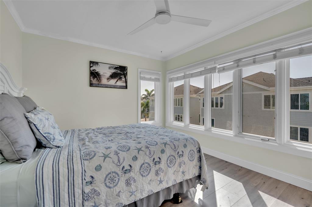 848 Evergreen Way Longboat Key, FL 34228 - Photo 26 of 66 a bedroom with a large bed and a window