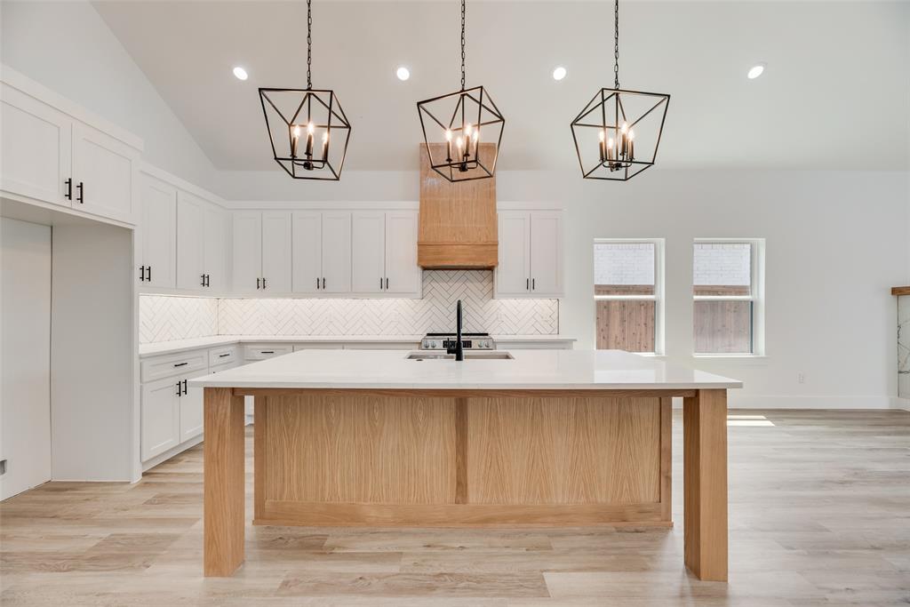 110 Hesed Street Greenville, TX 75402 - Photo 11 of 33 a view of a kitchen with a sink stainless steel appliances and cabinets