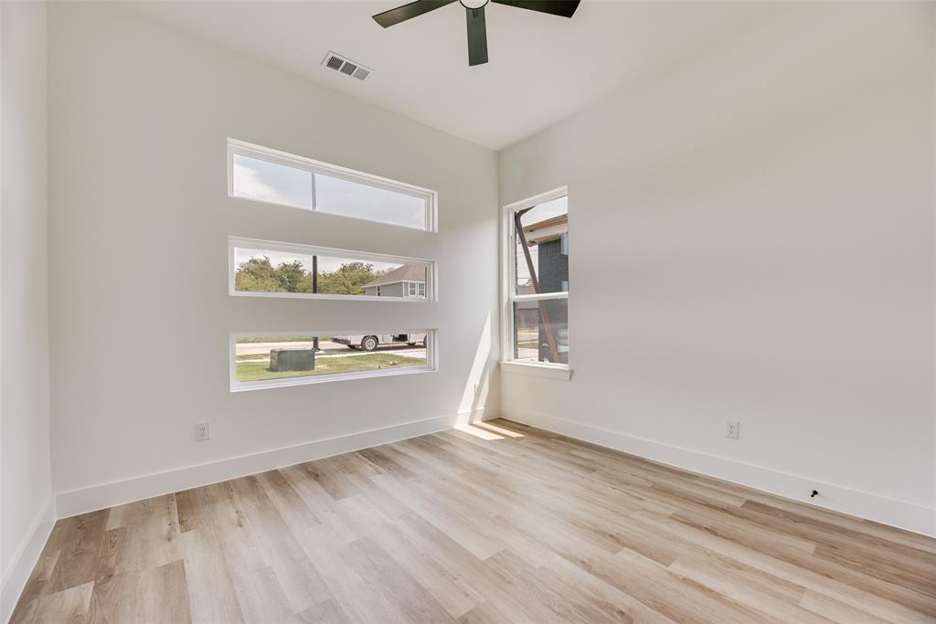 110 Hesed Street Greenville, TX 75402 - Photo 13 of 33 an empty room with windows