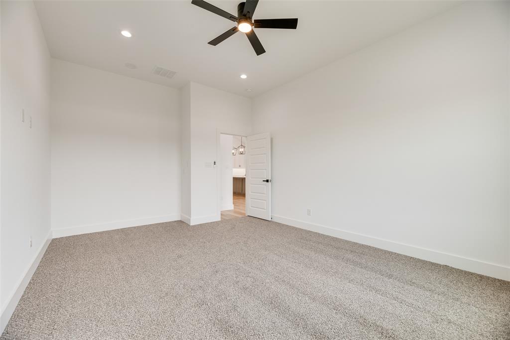 110 Hesed Street Greenville, TX 75402 - Photo 16 of 33 an empty room with closet and windows