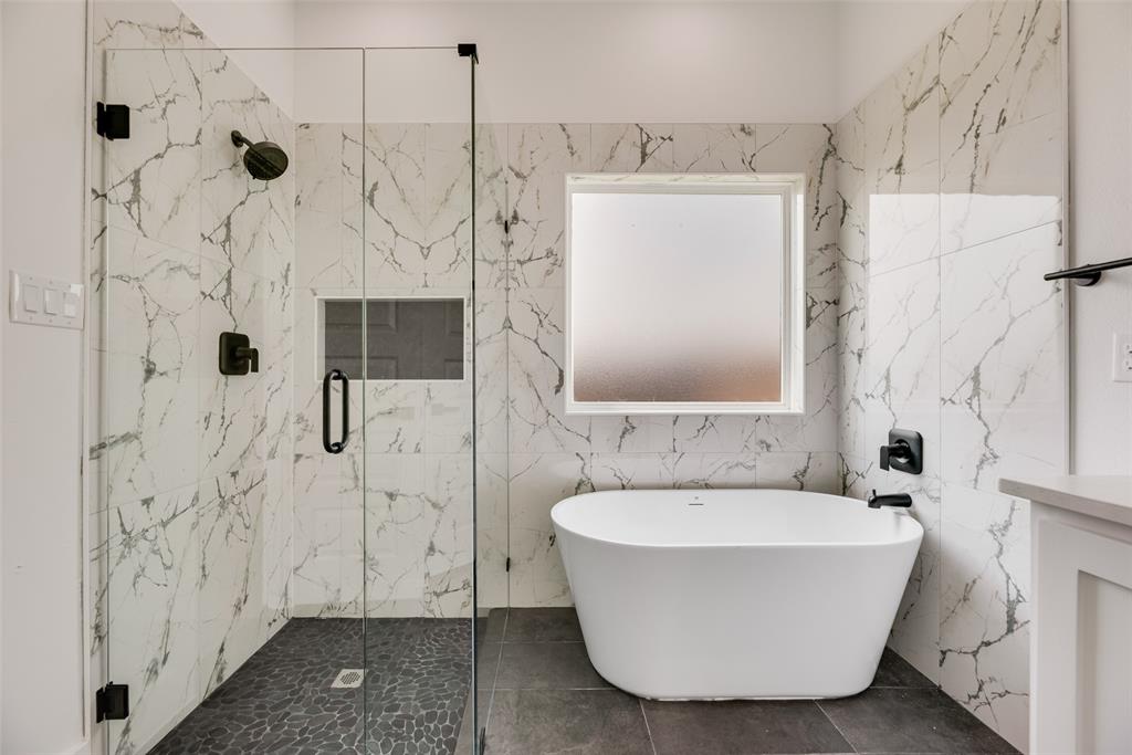 110 Hesed Street Greenville, TX 75402 - Photo 17 of 33 a bathroom with a bathtub and shower