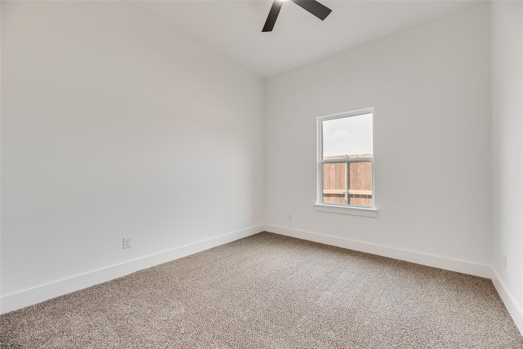 110 Hesed Street Greenville, TX 75402 - Photo 19 of 33 an empty room with windows