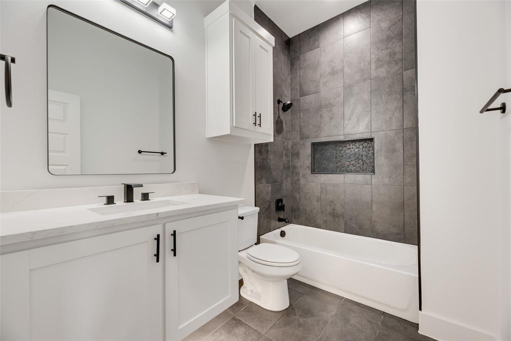 110 Hesed Street Greenville, TX 75402 - Photo 21 of 33 a bathroom with a sink toilet and shower