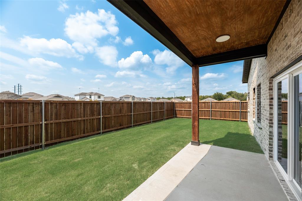 110 Hesed Street Greenville, TX 75402 - Photo 24 of 33 a view of a backyard with wooden fence