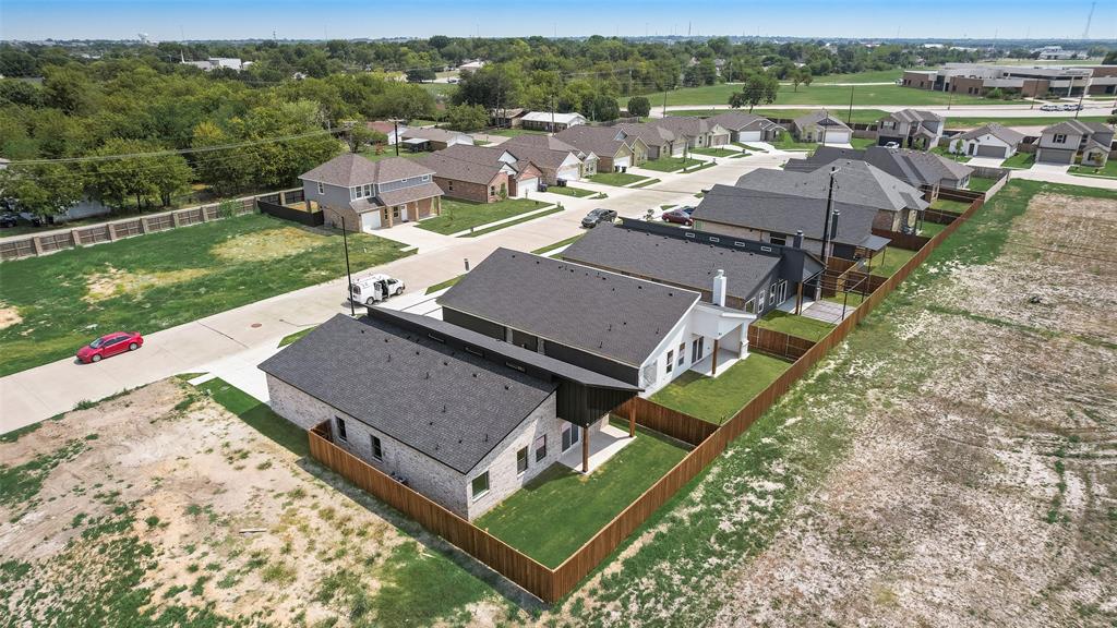 110 Hesed Street Greenville, TX 75402 - Photo 29 of 33 an aerial view of a house with a garden and lake view