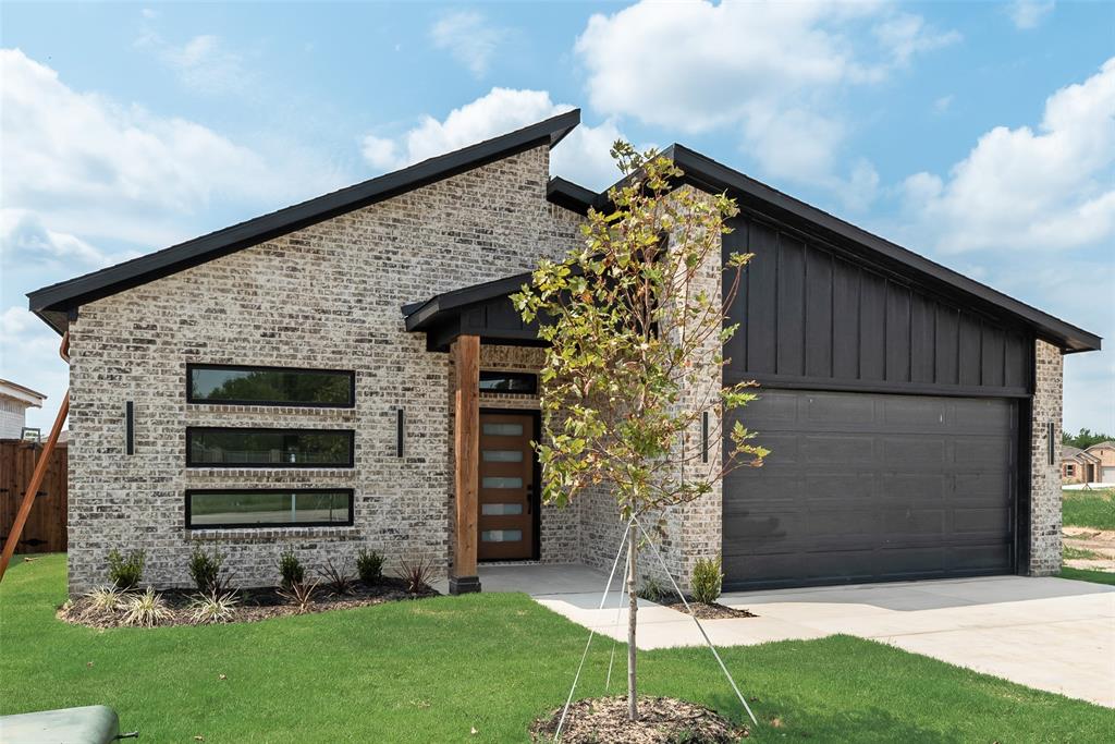 110 Hesed Street Greenville, TX 75402 - Photo 33 of 33 a front view of a house with garden