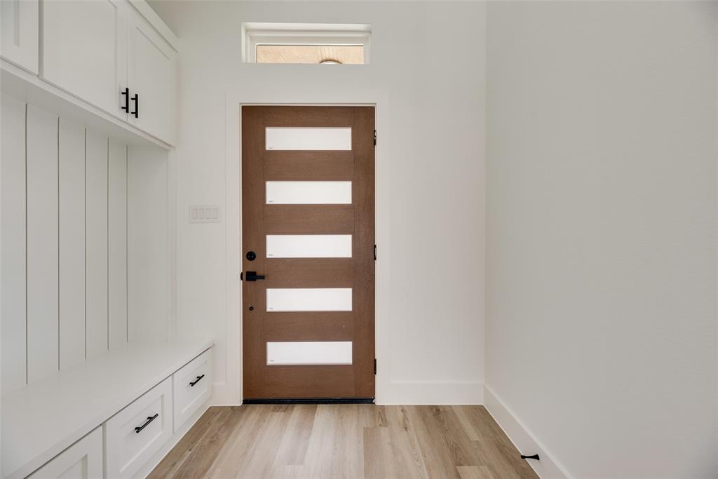 110 Hesed Street Greenville, TX 75402 - Photo 4 of 33 a view of walk in closet with empty racks