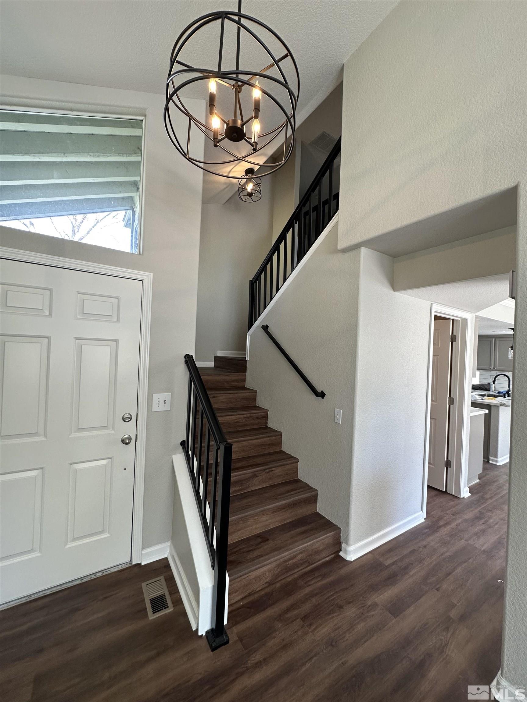 7485 Wheeldale Circle Reno, NV 89511 - Photo 8 of 12 a view of entryway and hall with wooden floor