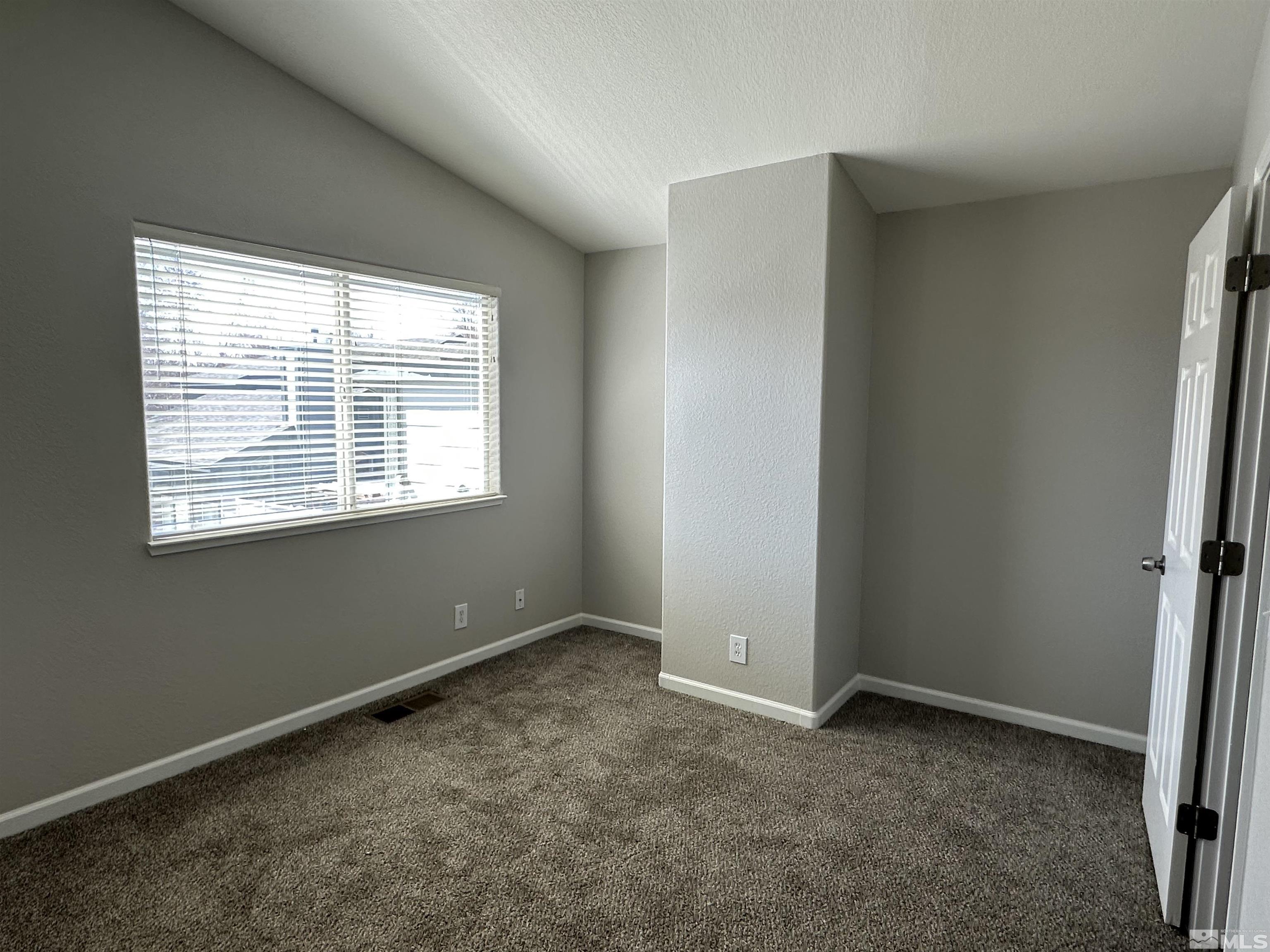 7485 Wheeldale Circle Reno, NV 89511 - Photo 9 of 12 a view of an empty room with a window