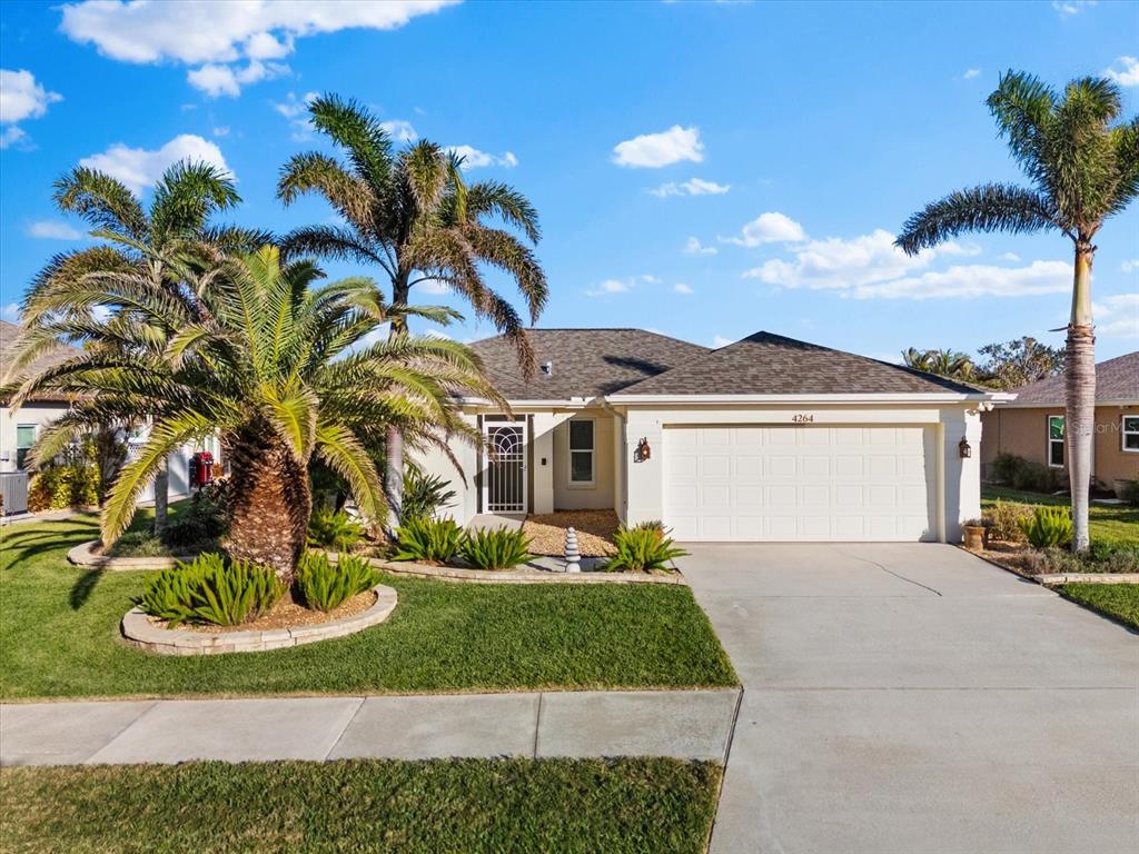 4264 Wordsworth Way Venice, FL 34293 - Photo 1 of 1 Front of Home WITH LUSH LANDSCAPING