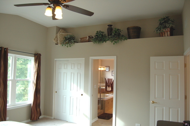 221 Ellis Road Lake In The Hills, IL 60156 - Photo 15 of 28 a view of a hallway with a chandelier
