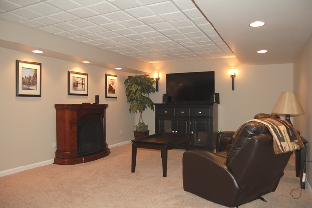 221 Ellis Road Lake In The Hills, IL 60156 - Photo 22 of 28 a living room with furniture and a flat screen tv