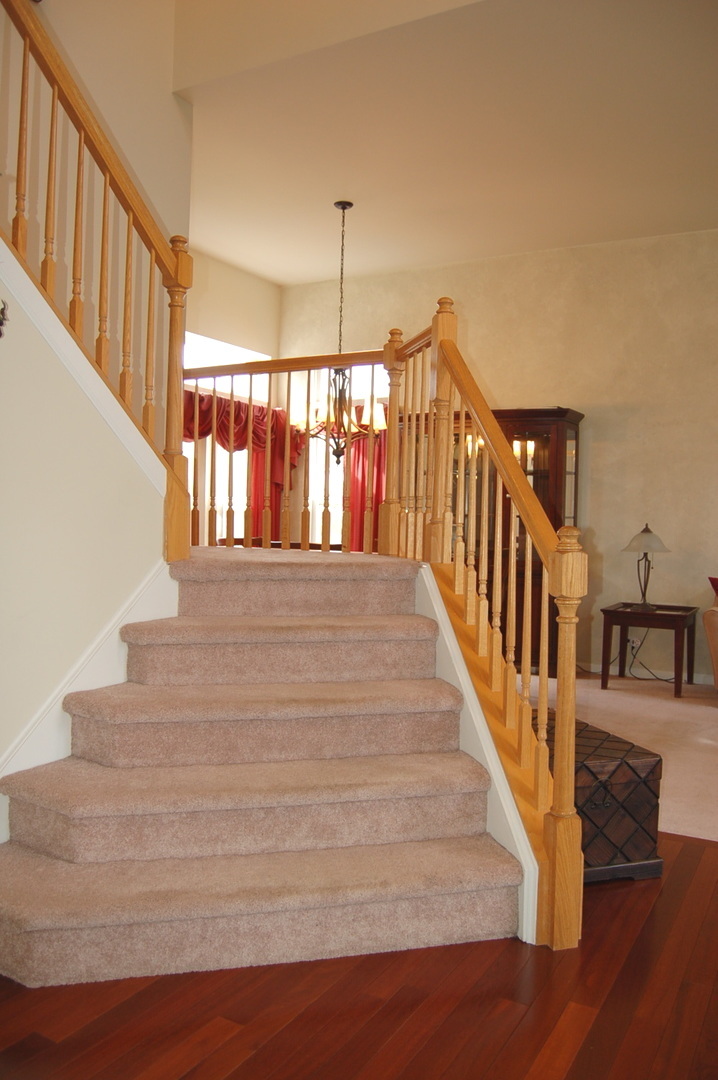 221 Ellis Road Lake In The Hills, IL 60156 - Photo 10 of 28 a view of entryway and hall with wooden floor