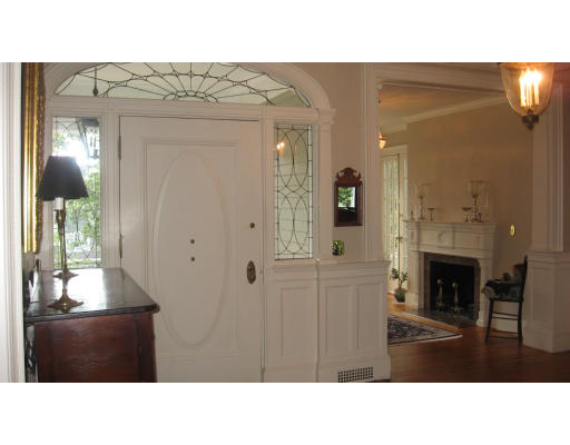 78 Abbott Road Wellesley, MA 02481 - Photo 2 of 23 a room with a bed and a mirror