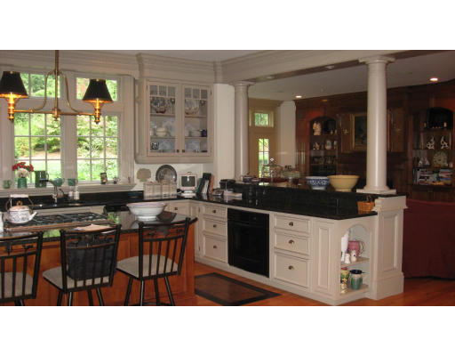 78 Abbott Road Wellesley, MA 02481 - Photo 5 of 23 a kitchen with stainless steel appliances kitchen island granite countertop a sink and cabinets