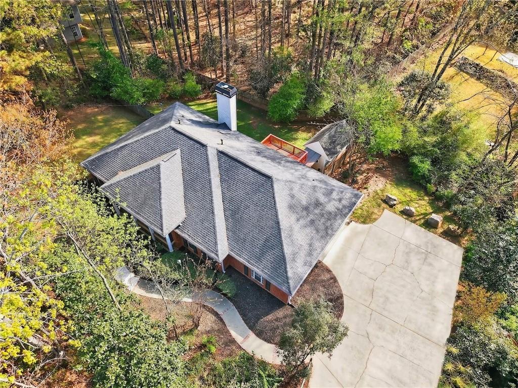 2038 Buford Dam Road Buford, GA 30518 - Photo 11 of 56 a view of a yard with large trees
