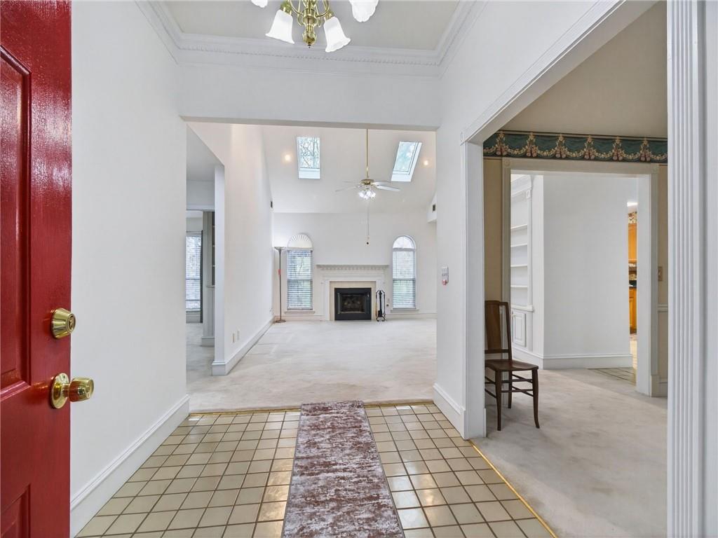 2038 Buford Dam Road Buford, GA 30518 - Photo 14 of 56 a view of a hallway with wooden floor and a living room