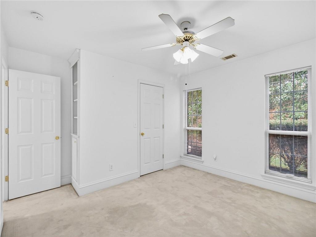 2038 Buford Dam Road Buford, GA 30518 - Photo 19 of 56 a view of an empty room with a window