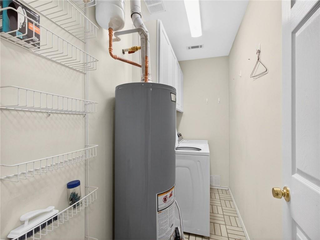 2038 Buford Dam Road Buford, GA 30518 - Photo 20 of 56 a bathroom with a sink and mirror