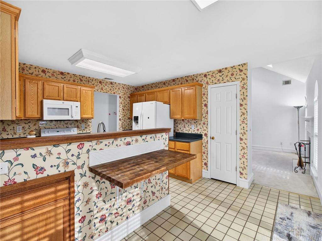 2038 Buford Dam Road Buford, GA 30518 - Photo 25 of 56 a living room with stainless steel appliances kitchen island granite countertop furniture and a rug