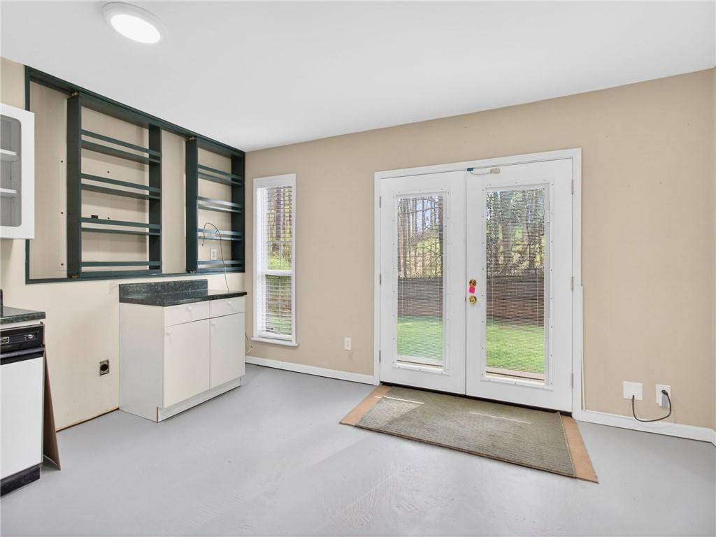 2038 Buford Dam Road Buford, GA 30518 - Photo 46 of 56 a room with a dresser and a window